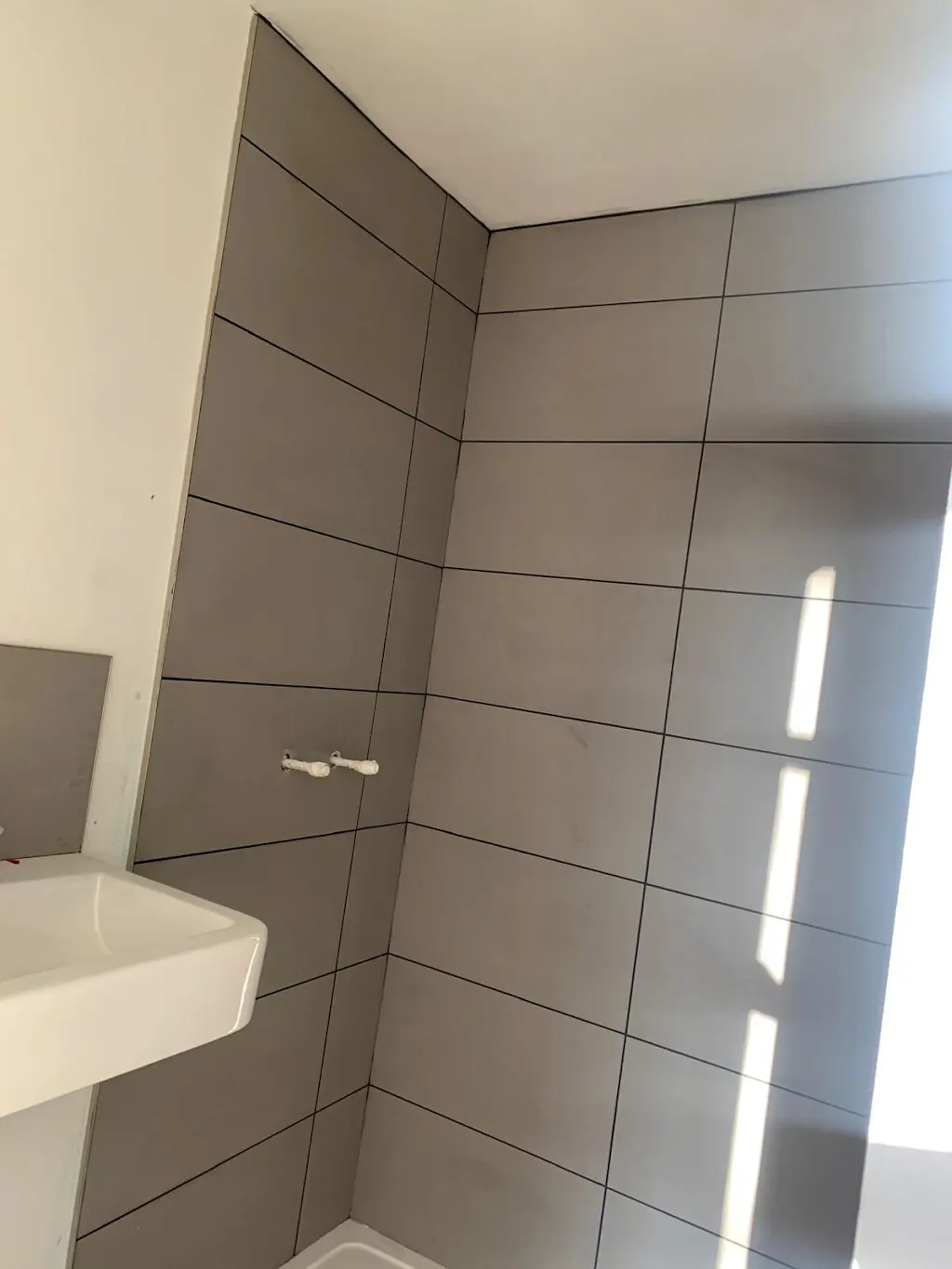 Bathroom tiling and plumbing work by Victory 2000